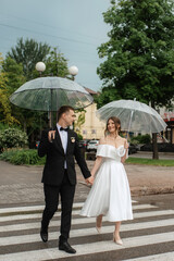 young couple bride and groom in a white short dress