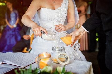 bride and groom holding hands