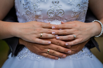 bride and groom holding hands