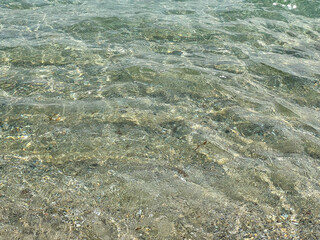 Green shimmering surface of sea water