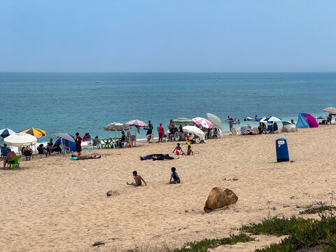 Group of people enjoying their summer holiday on the beach