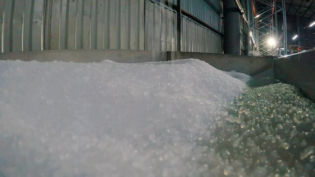 Polypropylene drop. Plastic granules fall in slow motion. Polypropylene granules closeup slowmotion