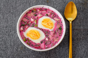 Cold beetroot soup with eggs and fresh vegetables. Popular Polish and Ukrainian meal during summer