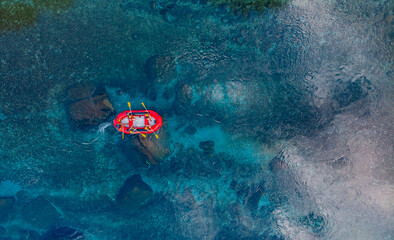 Aerial view rafting on red boat on blue river Turkey. Concept adventure extreme travel