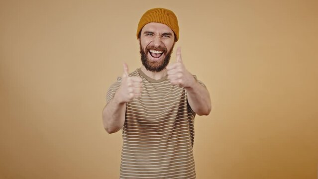 Middle-aged man shows thumbs-up with excitement closeup