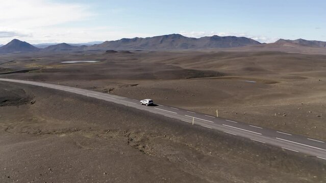 Aerial of car driving through Icelandic highlands 