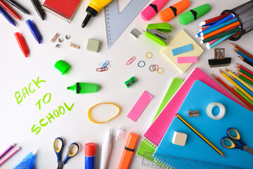 Assortment of colorful school supplies on desk back to school