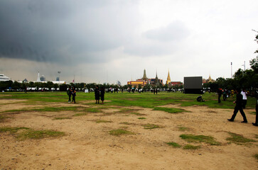 Naklejka na ściany i meble Thai people and foreign travelers walking travel visit in Sanam Luang public garden park and Phra Kaew temple or Wat Phra Si Rattana Satsadaram and Grand Palace on October 16, 2016 in Bangkok Thailand