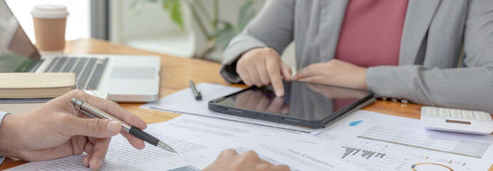 Brainstorm team, Marketers and financial accountants are discussing and analyzing charts to plan...