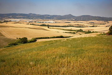 Fototapeta na wymiar Tuscany landscape, hills fields, mountains, grass, hay