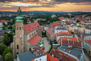 Fototapeta premium Beautiful architecture of the Town Hall Square in Jelenia Gora at sunset, Poland