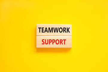 Teamwork support symbol. Concept words Teamwork support on wooden blocks on a beautiful yellow table yellow background. Business and teamwork support concept. Copy space.
