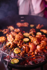 Close-up of grilled chicken legs and vegetables