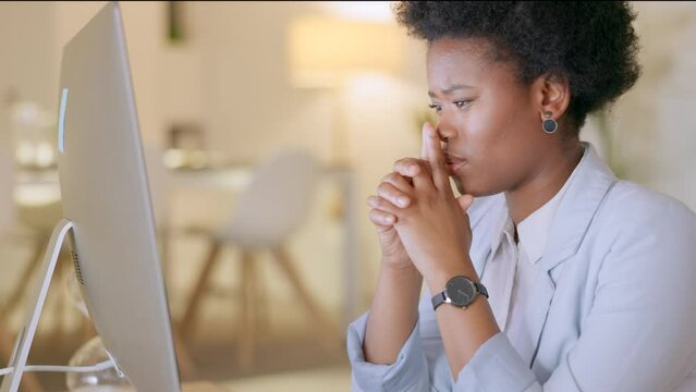 Stressed woman looking at results of a failing business in a modern office. Young professional office worker reading an a negative email about being being retrenched. Anxious female looking hopeless