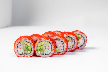 Sushi California roll in tobiko with shrimp.