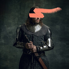 Artwork. Young man as medieval warrior, knight isolated on dark vintage background. Random stroke...