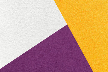 Fototapeta na wymiar Texture of craft white, yellow and dark violet shade color paper background, macro. Structure of abstract cardboard
