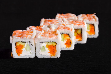 Rolls with crab meat, rice, nori, cream cheese, cucumber