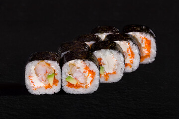 Rolls with nori, rice, cream cheese, tobiko caviar
