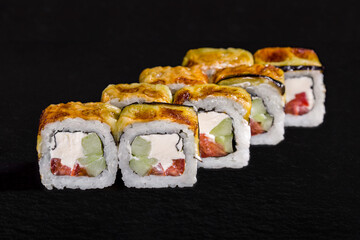 Rolls with rice, nori, cream cheese, cucumber
