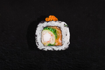 Roll with salmon caviar, black tobiko caviar, cream cheese, eel