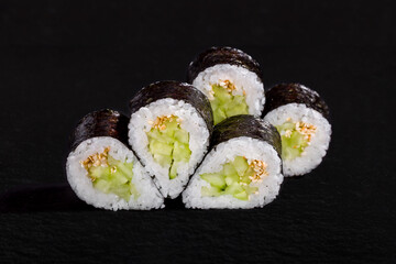 Rolls with nori, rice, cucumber and sesame seeds
