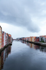 Fototapeta premium Trondheim, Norway reflection of colorful houses on the river on an overcast day 