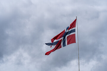 Norwegian Flag blowing in the wind on an overcast day 
