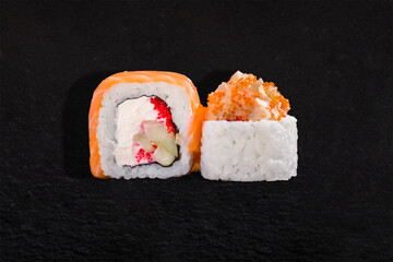 Rolls with salmon, nori, rice, cream cheese