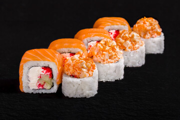 Rolls with salmon, nori, rice, cream cheese