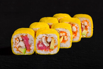 Rolls with cheese, rice, tuna, avocado, eel and tobiko caviar