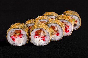 Warm breaded roll with nori, rice, cream cheese, tobiko caviar