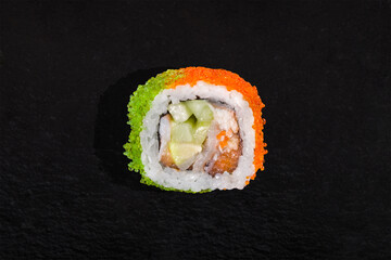 Rolls with nori, green and orange tobiko caviar, eel