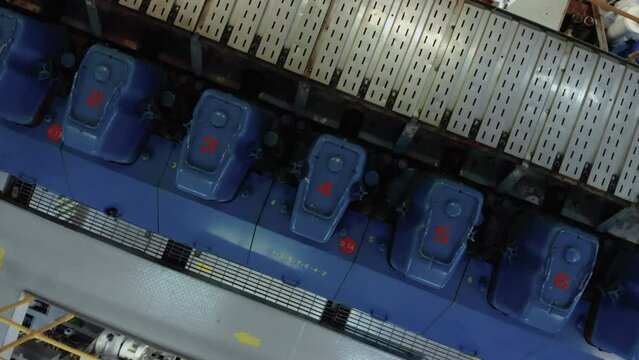 Top of large engine in engine room of ship