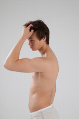 Obraz premium Young man with his shirt off