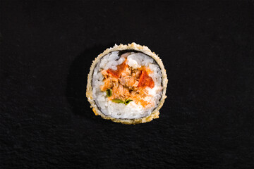 Warm breaded roll with nori, rice, tobiko caviar, onion