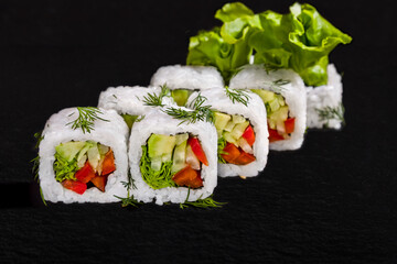 Roll with dill, rice, avocado, pepper, lettuce and cucumber