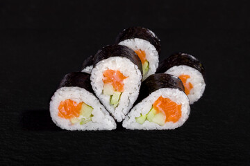 Rolls with nori, rice, salmon and cucumber