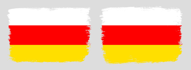 A set of two vector brush flags of South Ossetia with abstract shape brush stroke effect