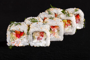 Roll with sesame seeds, dill, rice, pepper, lettuce