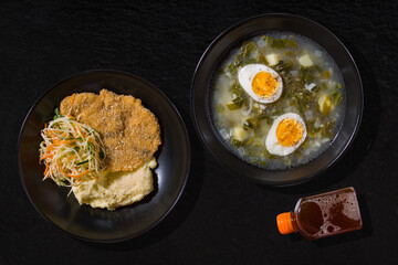 Vegetable soup and mashed potatoes with chicken cutlet