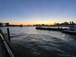 Fototapeta premium Sunset over the Thames and London from Greenwich Pier