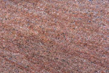 Texture and pattern of red granite close-up. Natural stone background