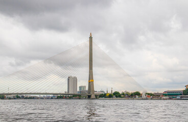 Fototapeta na wymiar A Bridge and the Chao Phraya River of the Capital City and Metropolis Bangkok Thailand Southeast Asia