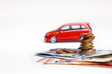 euro cash and toy vehicle isolated on white, money  for car loan payment and insurance concept