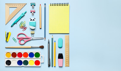 School supplies on blue background, copy space for text flat lay