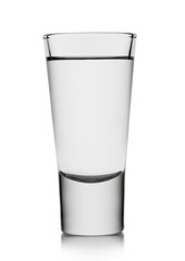 Classic shot glass with tequila or vodka on white background.
