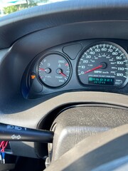 dashboard of car with warning lights