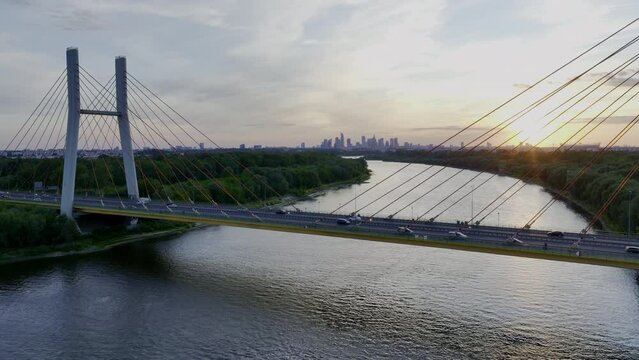 Aerial, elevation view of Siekierkowski Bridge in Warsaw a capital city during sundown.
