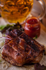 Fried pork steak, beef on the bone, sausages
